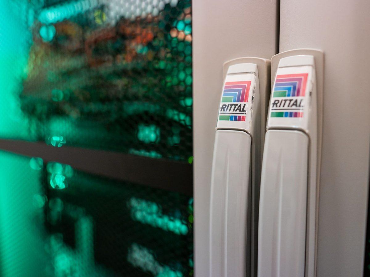 Data cabinets with green lighting – ALTEPRO server room